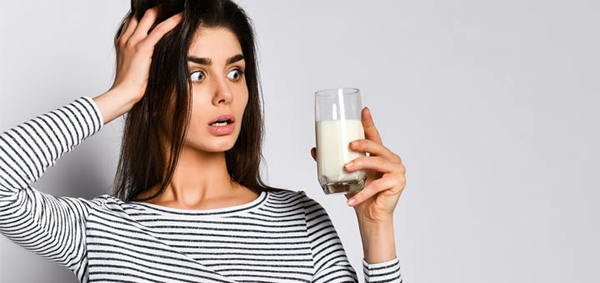 malefícios do leite e seus derivados - mulher assustada